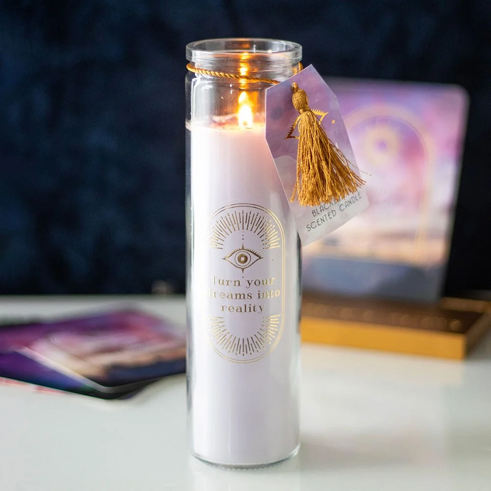 Blackberry scented candle in a tall glass tube with gold text and amethyst crystal chips inside