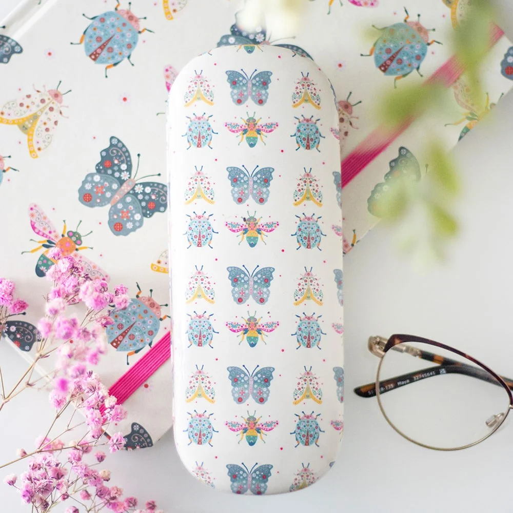 Durable hard shell floral glasses case with whimsical bug and flower print, shown closed on white background