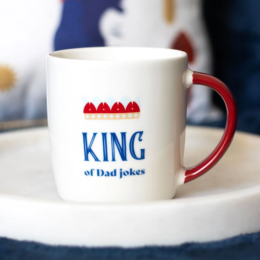 White dad jokes mug with red handle, crown graphic, and "King of Dad Jokes" text, 350ml capacity