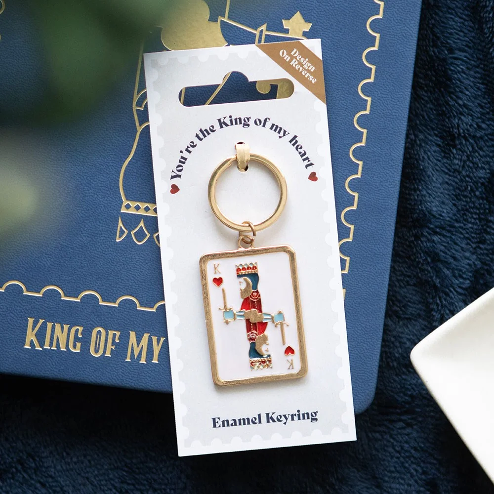 Gold-tone king playing card keyring with enamel design and 'You're the king of my heart' text on reverse side