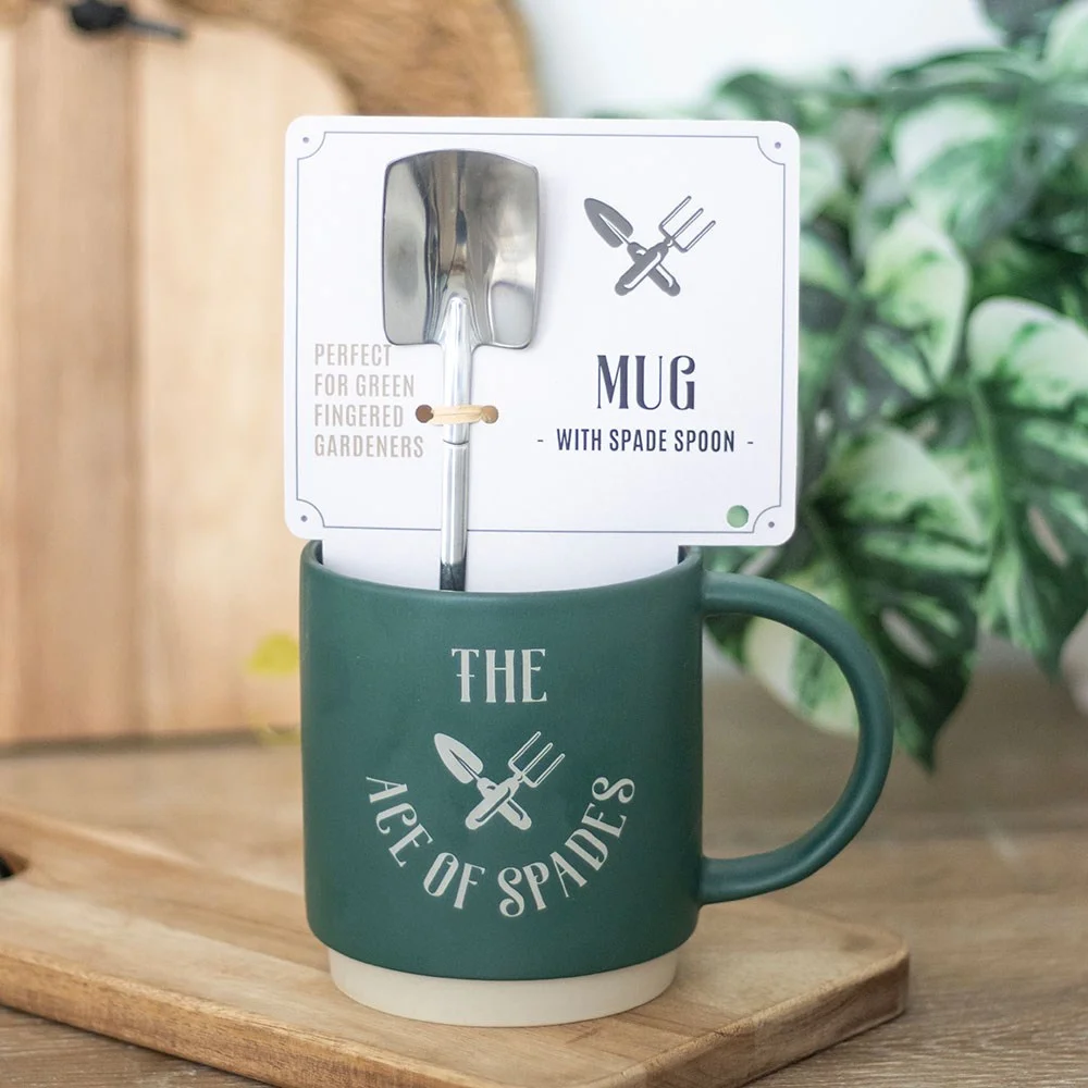 Ceramic Ace of Spades mug with black spade design and metal garden spade spoon, 500ml capacity, on white background