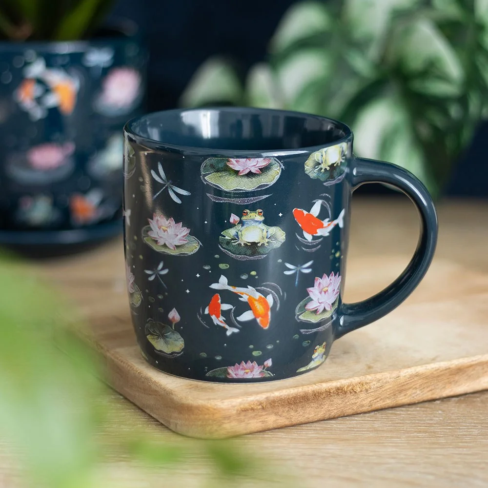 White ceramic nature print mug with lily pads, frogs, dragonflies, lily flowers, and koi fish design, 350ml capacity