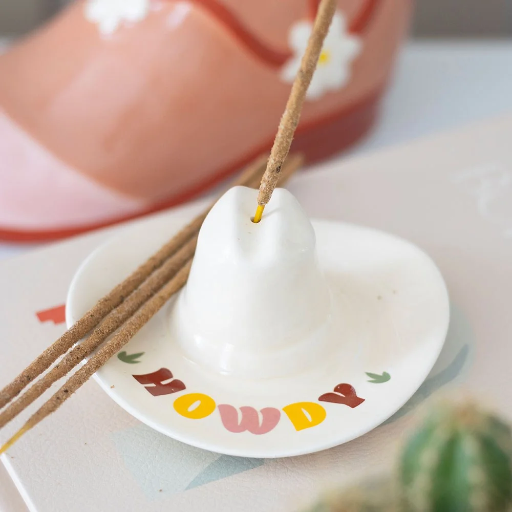 Mini cowboy hat incense holder with retro 'Howdy' text on brim, designed as a cowboy hat incense holder and trinket dish
