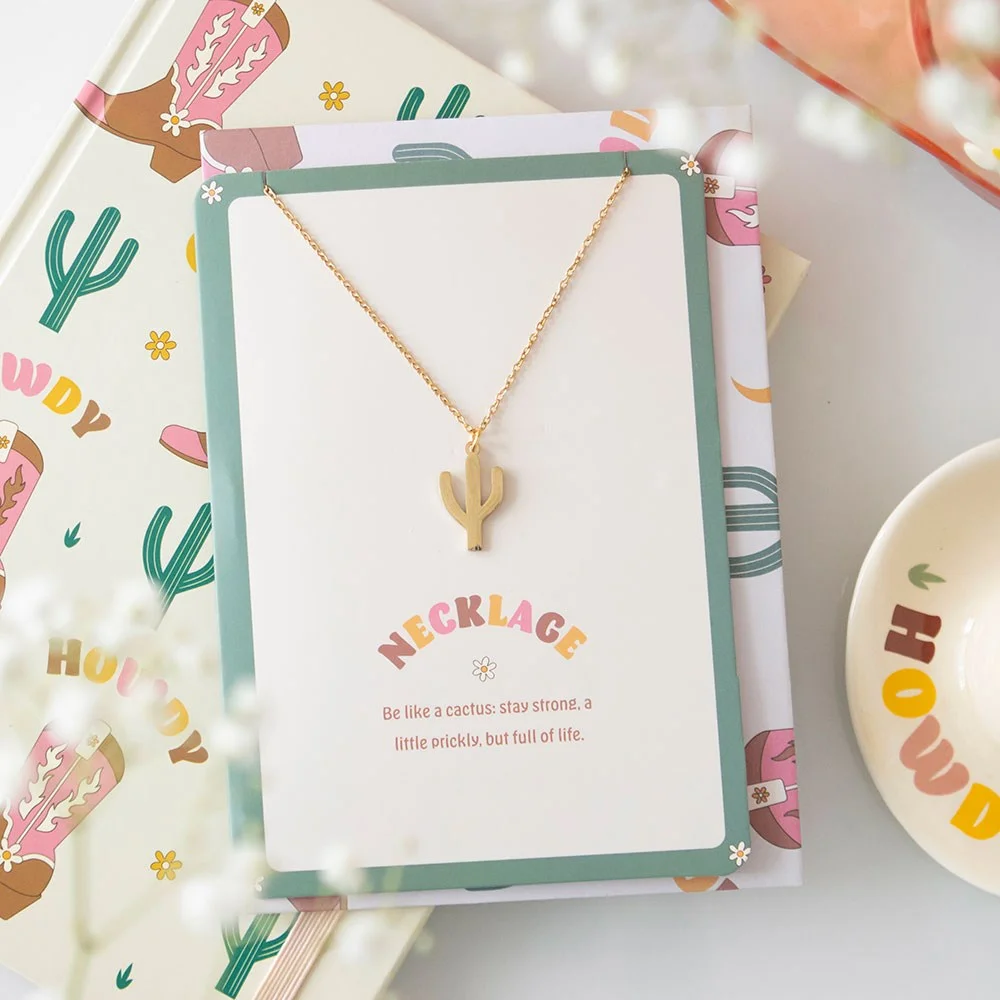 Cactus necklace made of nickel-free stainless steel displayed on greeting card with motivational cactus quote and envelope included