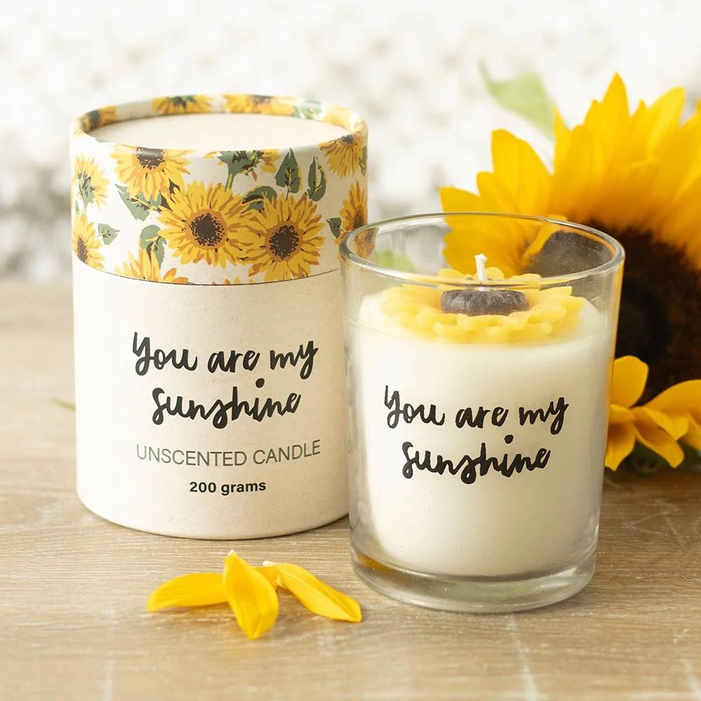You Are My Sunshine candle with 3D wax sunflower in glass holder, next to matching sunflower print gift box
