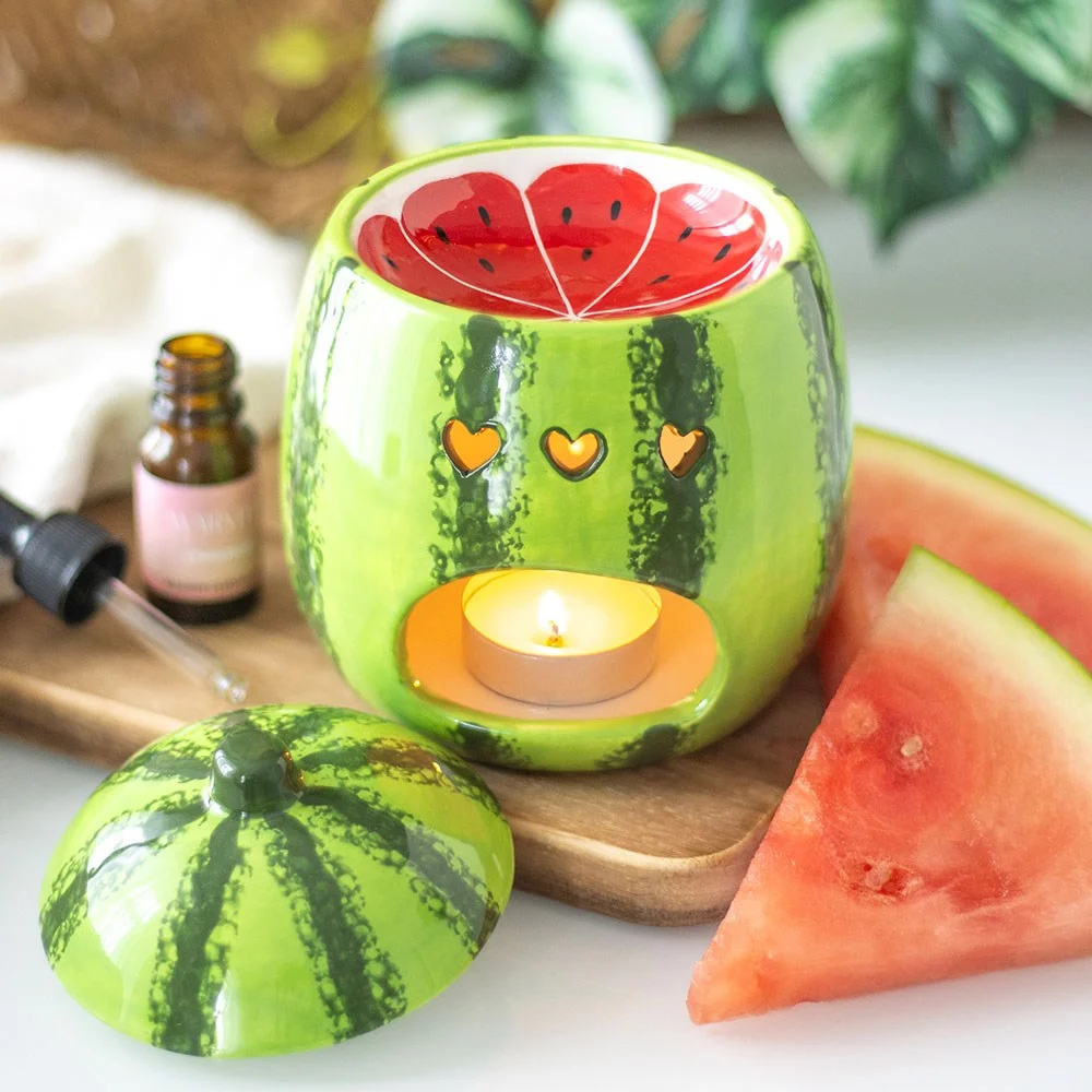 Watermelon oil burner shaped like a juicy watermelon with a removable lid and dish for wax or oil warming