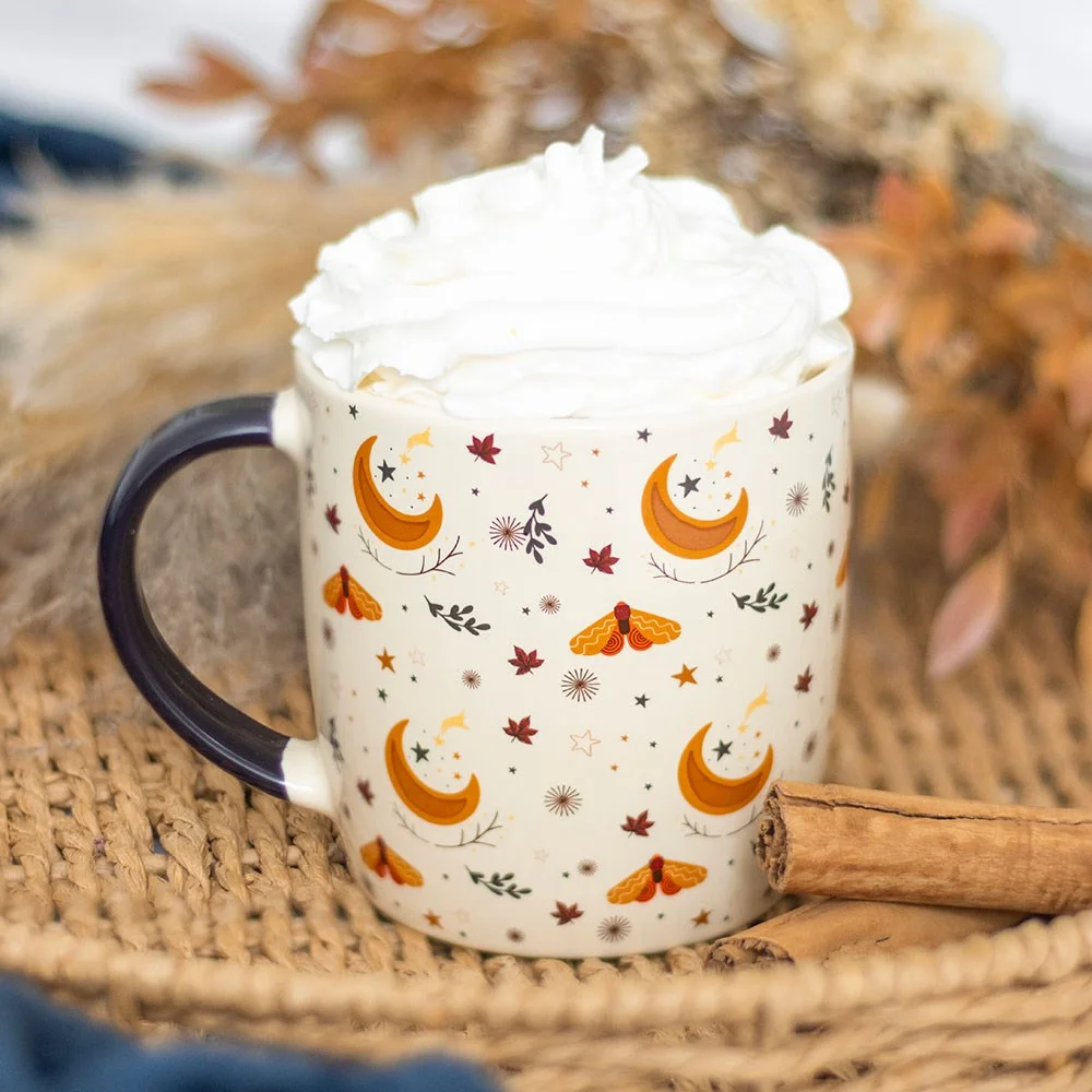 Ivory ceramic autumn print mug with harvest moon, delicate leaves, and golden stars, 340ml capacity