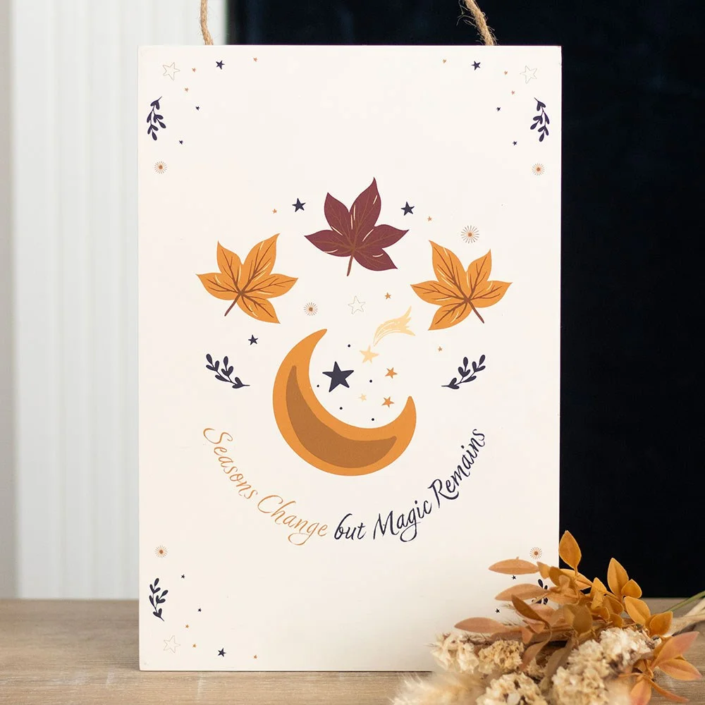 Rustic autumn hanging sign with "Seasons Change but Magic Remains" text, perfect for seasonal home decor