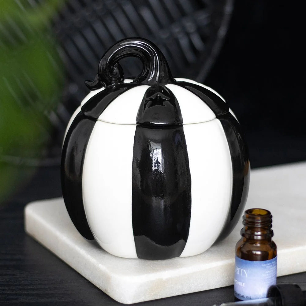 Black and white striped pumpkin oil burner with removable lid and space for tealight and fragrance oils on top