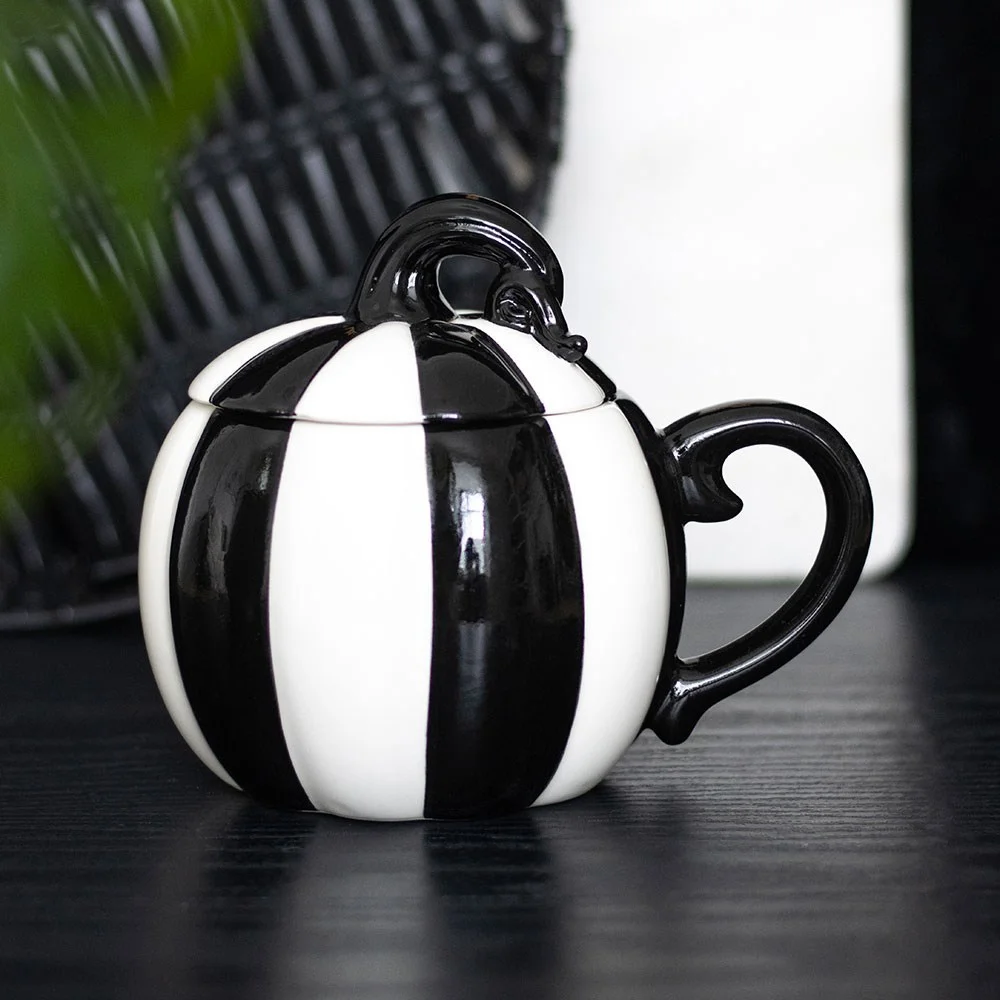 Black and white striped pumpkin mug with lid, bold design for hot drinks, hand wash only, no microwave use