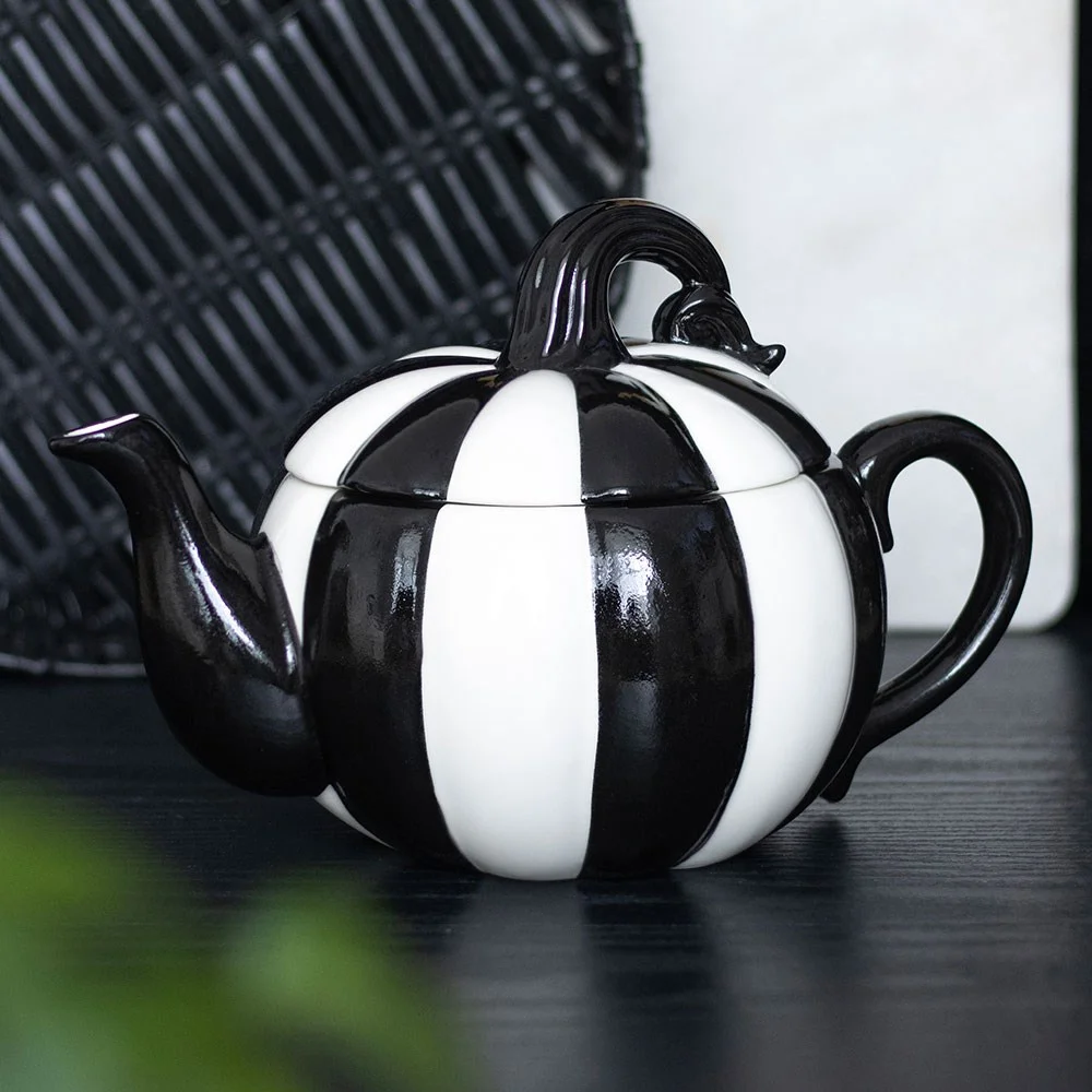 Black and white striped pumpkin teapot with curved spout and handle, 500ml capacity, on white background
