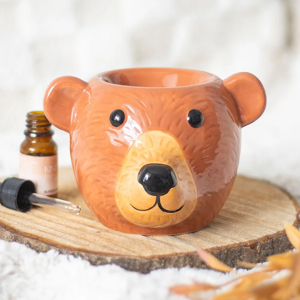 Ceramic bear shaped oil burner with a hollow center for fragrance oil, designed for home scenting and decoration
