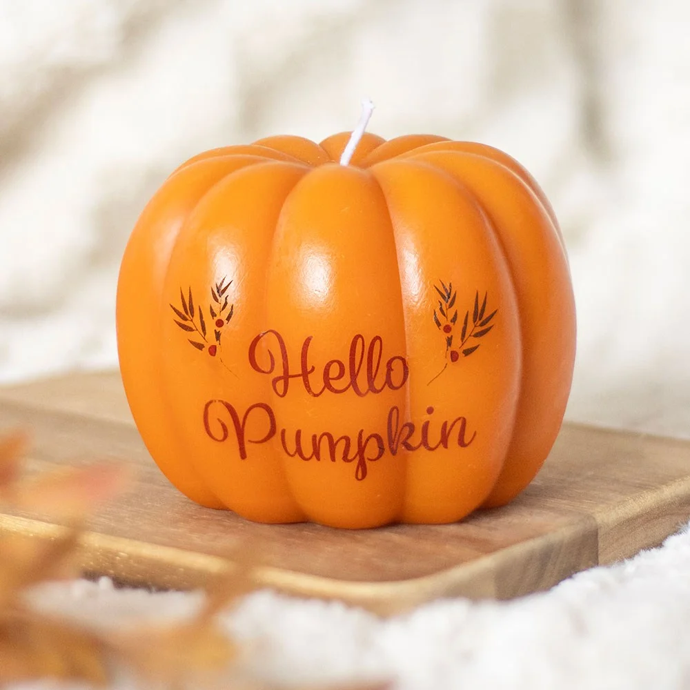 Unscented pumpkin shaped candle with "Hello Pumpkin" text, ideal for autumn home decor and seasonal warmth