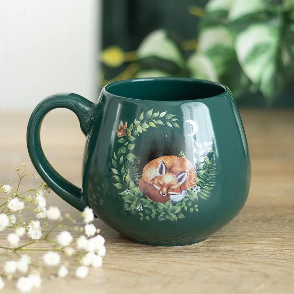 Green ceramic fox mug with sleeping fox design, rounded shape, 500ml capacity, hand wash only, nature-inspired gift mug