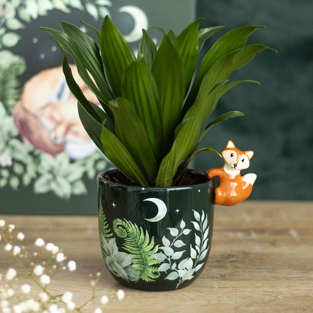 Ceramic fox plant pot with green forest foliage print and three‑dimensional fox on ceramic pot