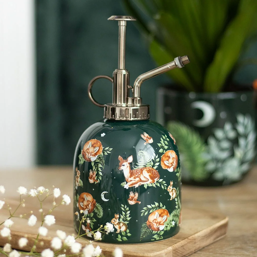 Ceramic plant mister with woodland print featuring foxes, fawns, rabbits, and birds, plastic nozzle on top