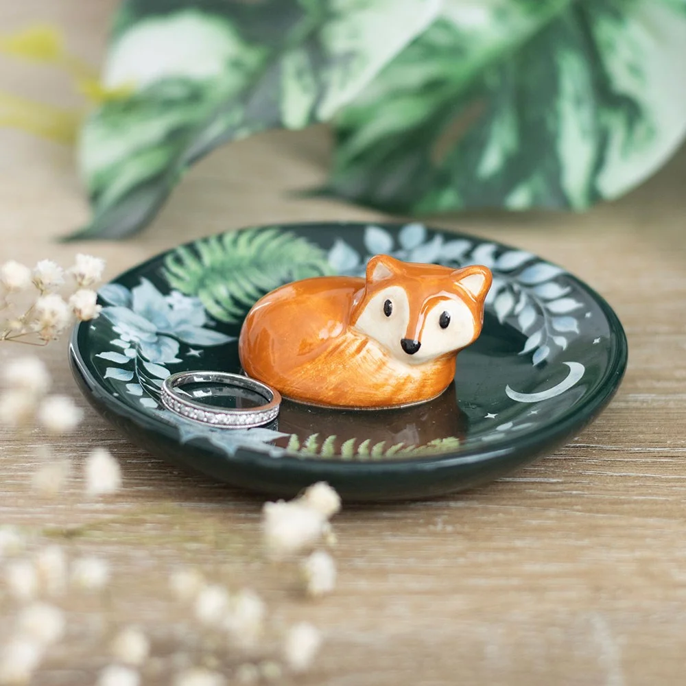 Ceramic trinket dish featuring a fox lounging amid woodland foliage, perfect for jewellery and small treasure storage.