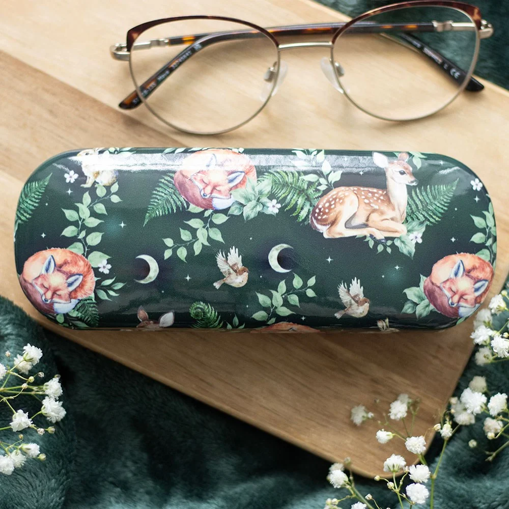 Lightweight hardshell glasses case with forest animal print and included microfibre cleaning cloth on white background
