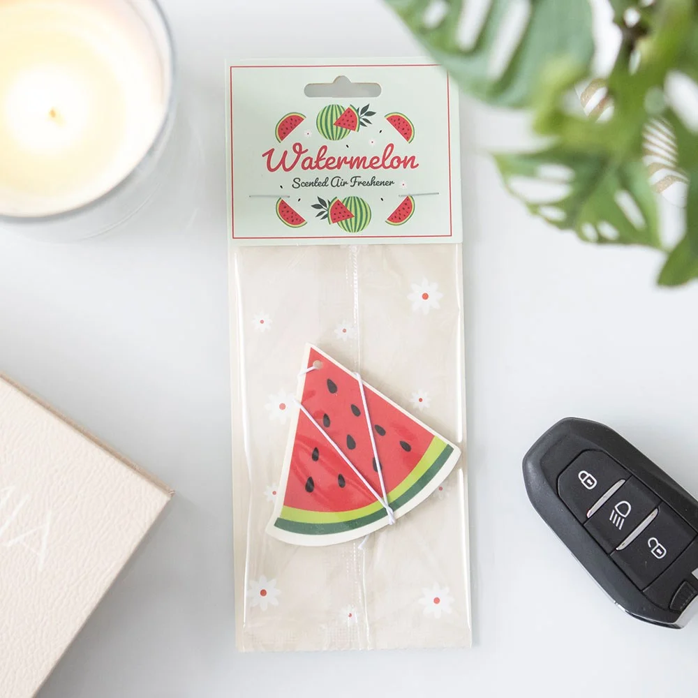 Watermelon-shaped air freshener with bright pink and green colours, designed for fresh fruity scent in cars or rooms