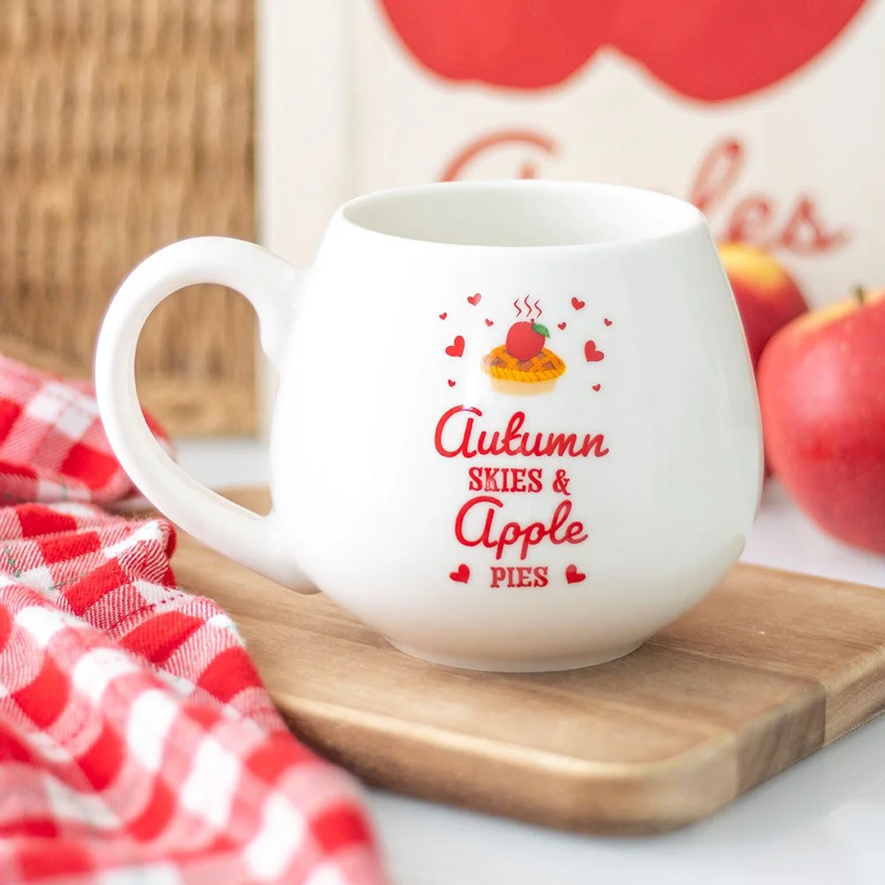 White autumn ceramic mug with "Autumn Skies & Apple Pies" text and country-style design, 550ml capacity