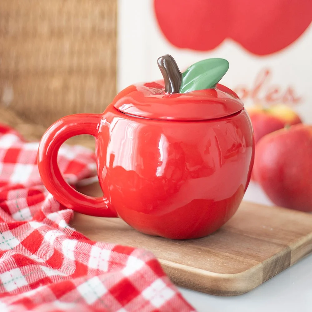 Apple shaped mug in red ceramic with matching lid, 550ml capacity, on white background