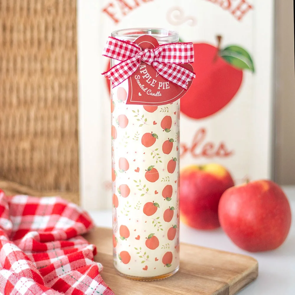 Apple pie scented candle in a printed tube with apple design, ideal for a cosy home atmosphere and gift giving