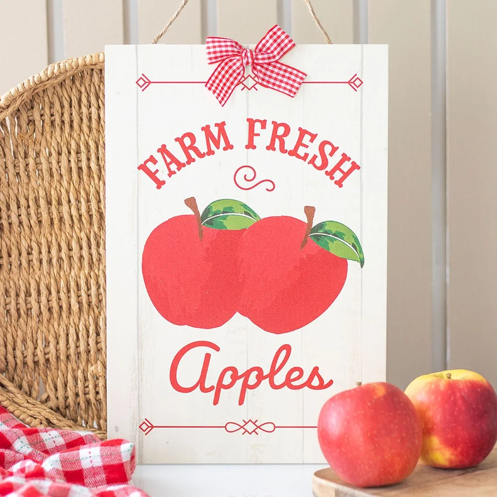 Rustic hanging sign with "Farm Fresh Apples" text, vintage style, ideal for kitchen or pantry decor