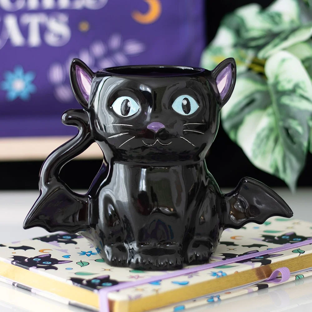 Black cat mug shaped like a cat with small bat wings, ceramic, 500ml capacity on a white background