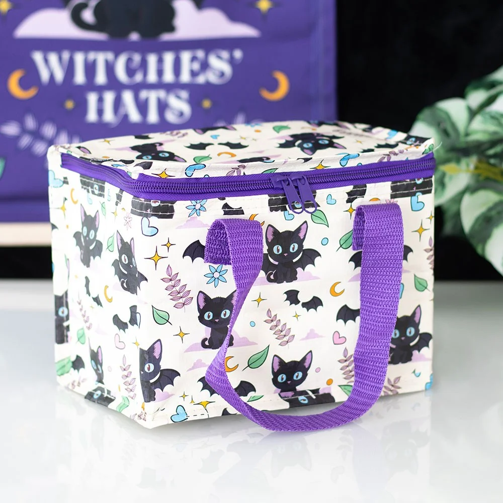 Black cat print lunch bag with purple handles, insulated and made from recycled plastic, on a white background