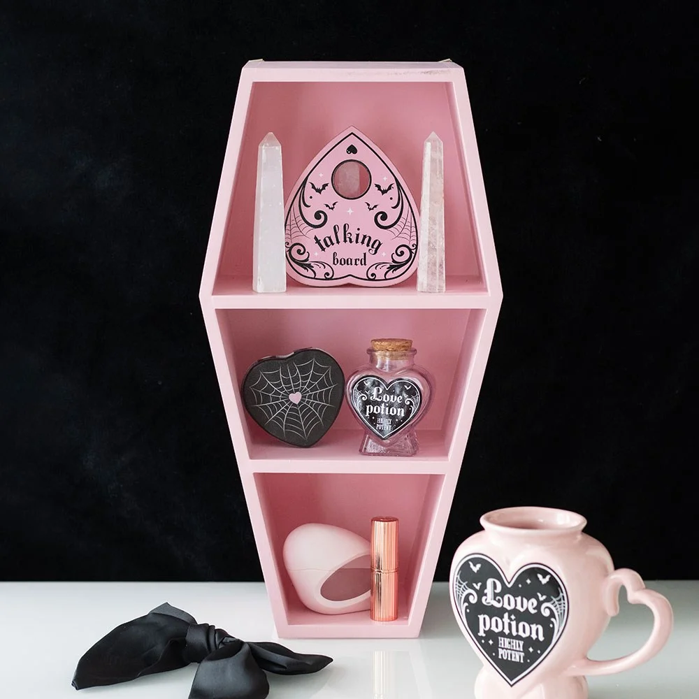 Pink coffin shelf made of MDF with a bold gothic design, perfect for displaying small ornaments or candles