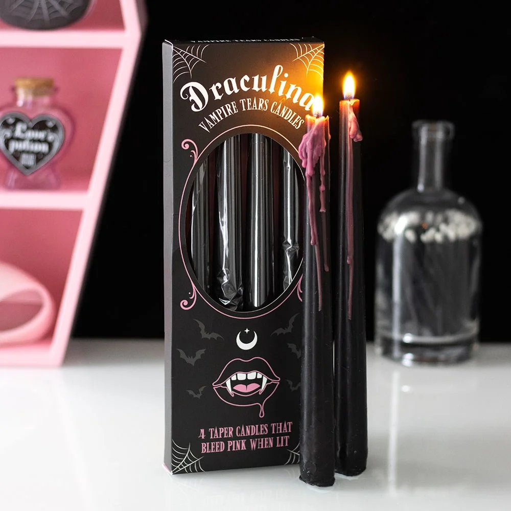 Set of 4 pink taper candles with vampire tears design showing dripping wax, unscented and approx 2-hour burn time each