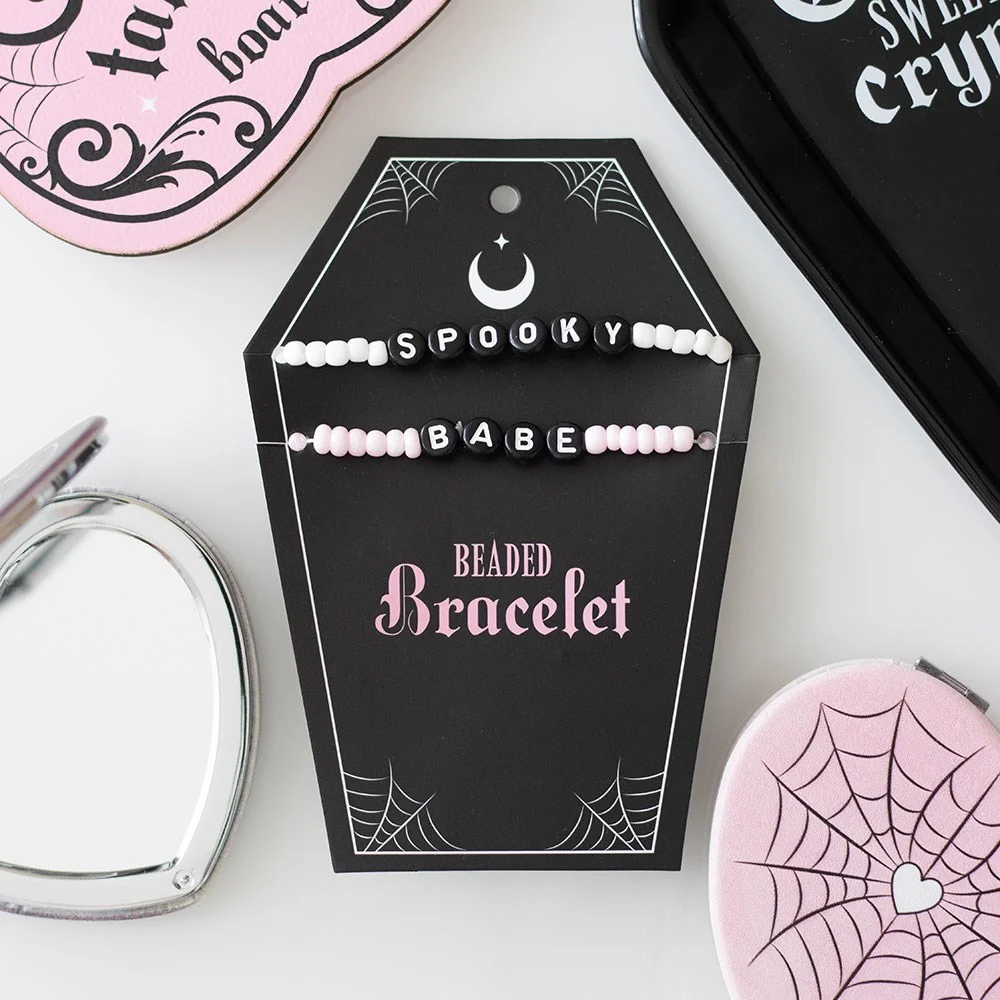 Gothic beaded bracelet set with pink and black plastic beads on a white background, named Spooky Babe