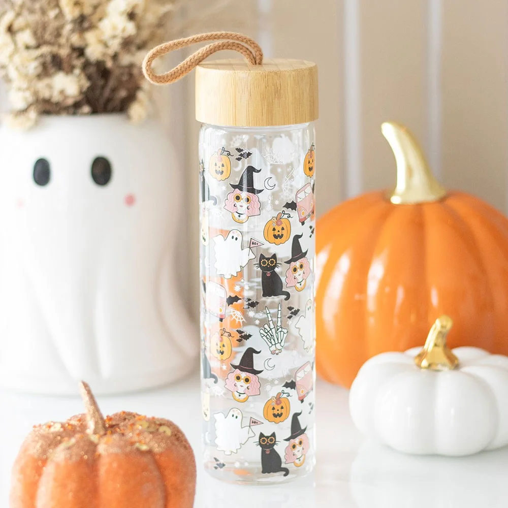 600ml glass water bottle with groovy ghost print, bamboo lid, and carrying loop for Halloween hydration