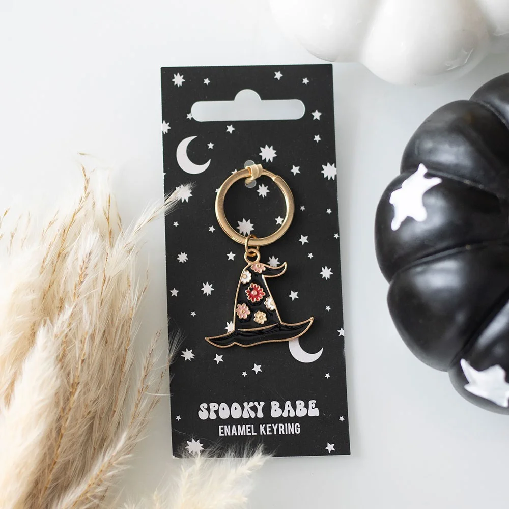 Black witch hat keyring with floral design on night-sky print card, perfect Halloween gift accessory