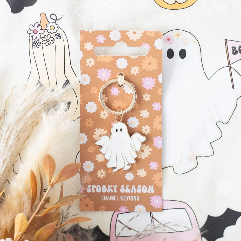 Spooky ghost keyring with playful ghost design on groovy floral print backing card for Halloween accessories