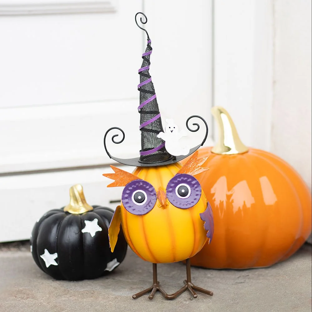 Orange owl ornament wearing a striped witch hat with a small ghost perched on top, detailed metal Halloween decoration