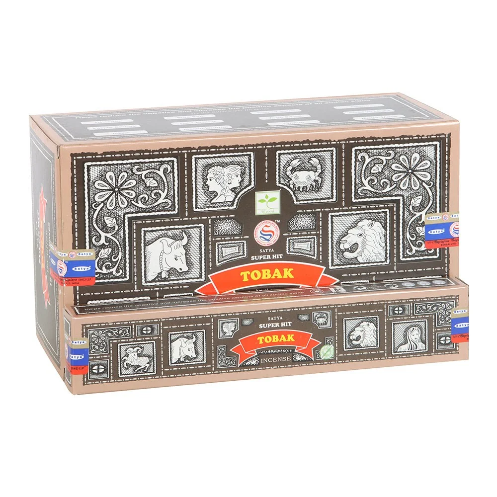 Box of 12 Satya Superhit Tobak incense packs, each 15g, displaying colorful packaging with brand and product name visible