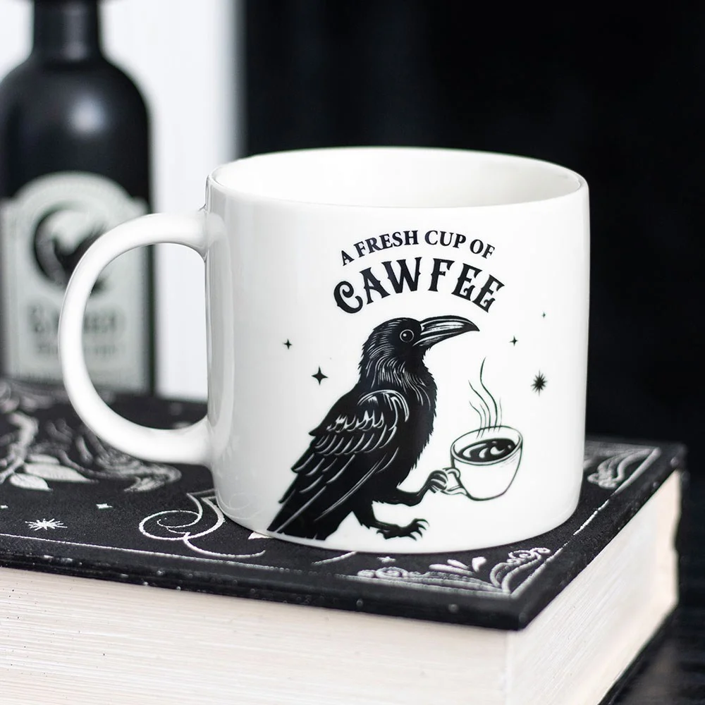 Ceramic 500ml raven coffee mug with raven illustration holding steaming cup, gothic style