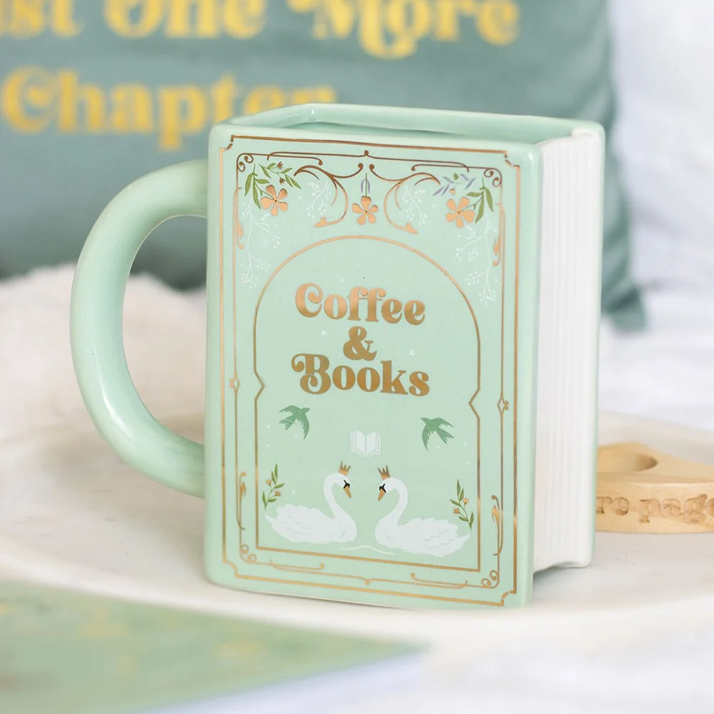 Green book shaped mug, ceramic, green color, shaped like a classic book with ‘Coffee and Books’ print.