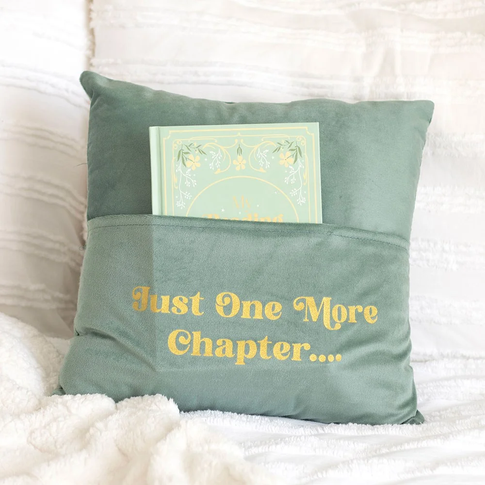 Soft pale green cushion with just one more chapter text and a handy front book pocket for reading nooks.