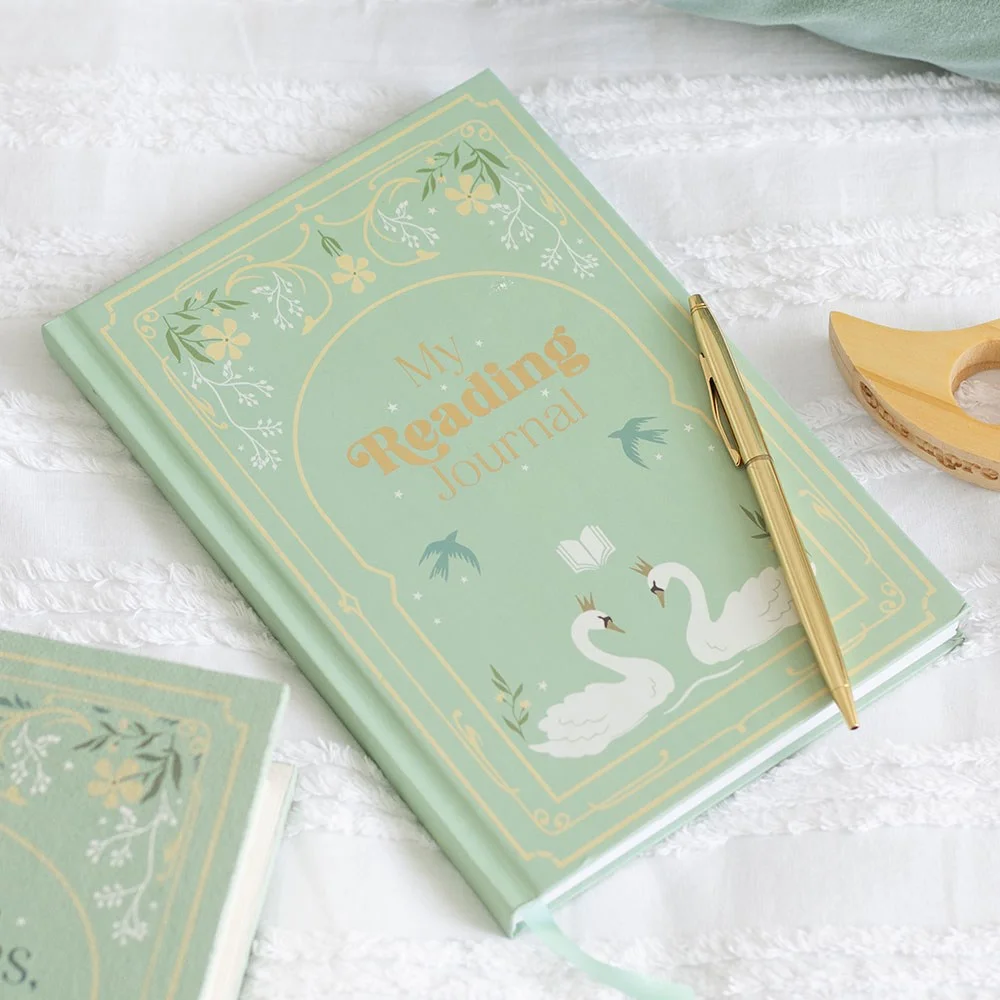 A5 reading journal with fairytale book cover, 200 lined pages, and a ribbon bookmark, open to show the pages.