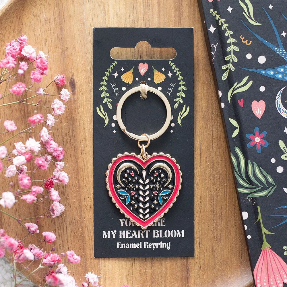Colourful enamel and alloy folk heart keyring with a vibrant folk-inspired heart design on a metal ring