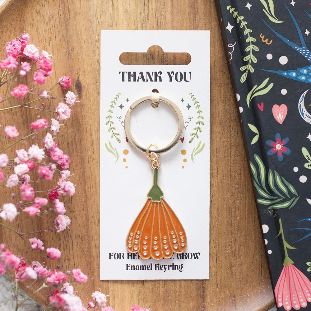 Thank you keyring with enamel flower design and message "Thank you for helping me grow" on alloy keyring ring
