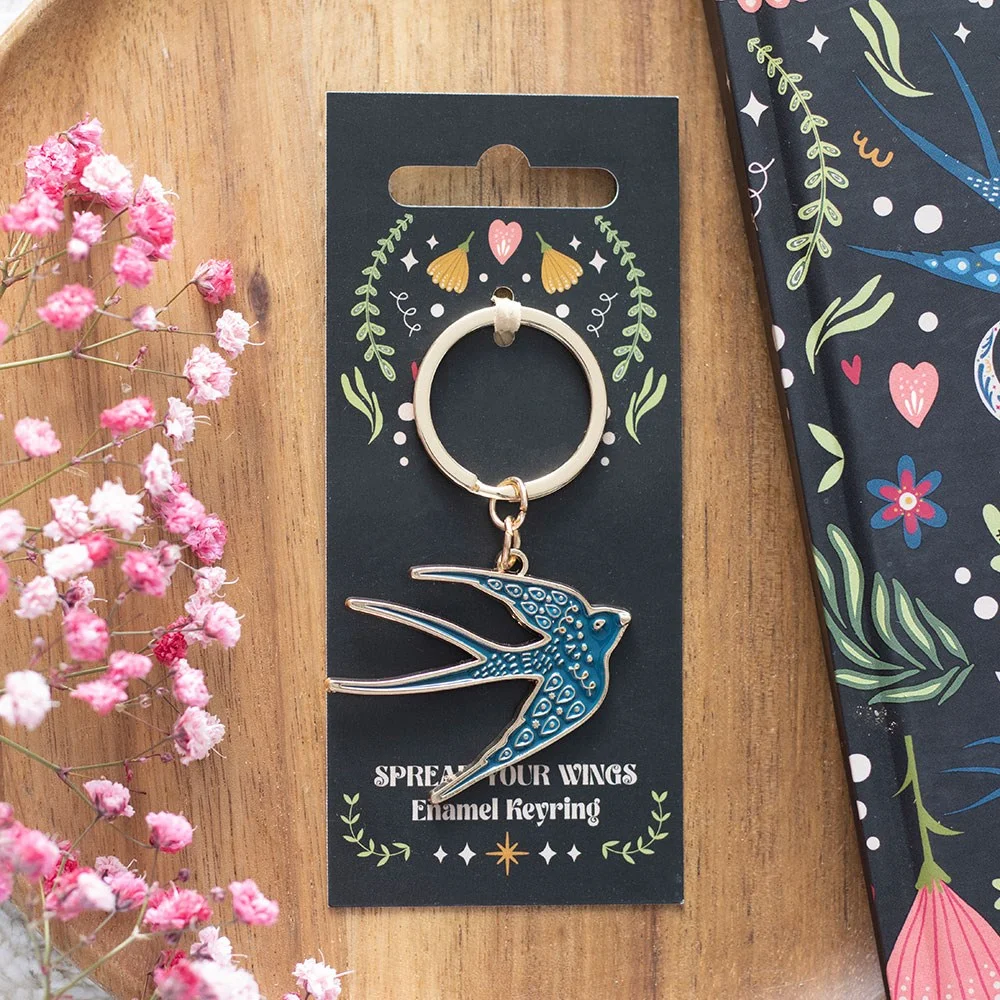 Blue swallow keyring made of enamel and alloy with a graceful blue bird design on a silver keyring loop