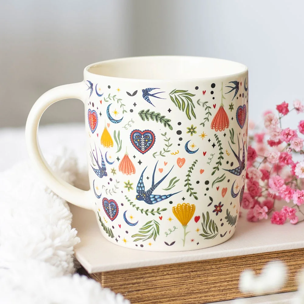 Cream ceramic floral mug with Midnight Bloom print, 350ml capacity, microwave and dishwasher safe