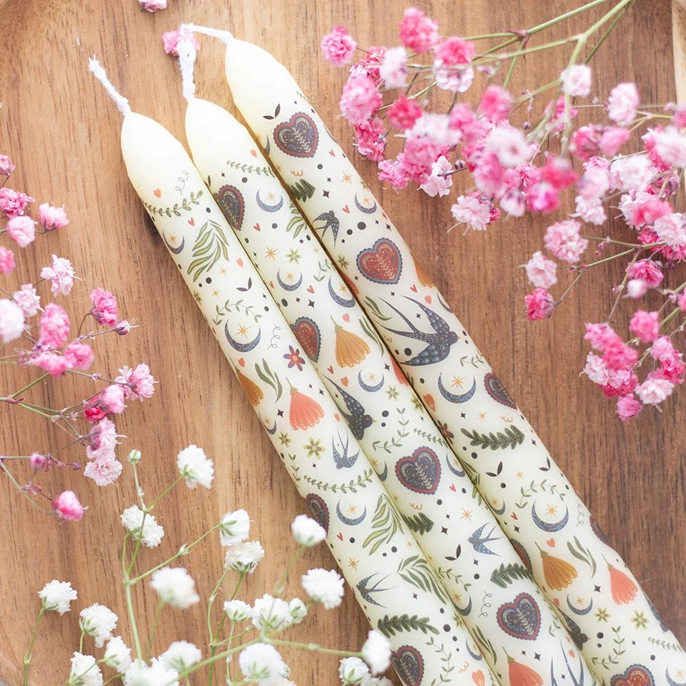 Set of 3 cream taper candles with delicate midnight bloom folk print, unscented and slender for decorative use
