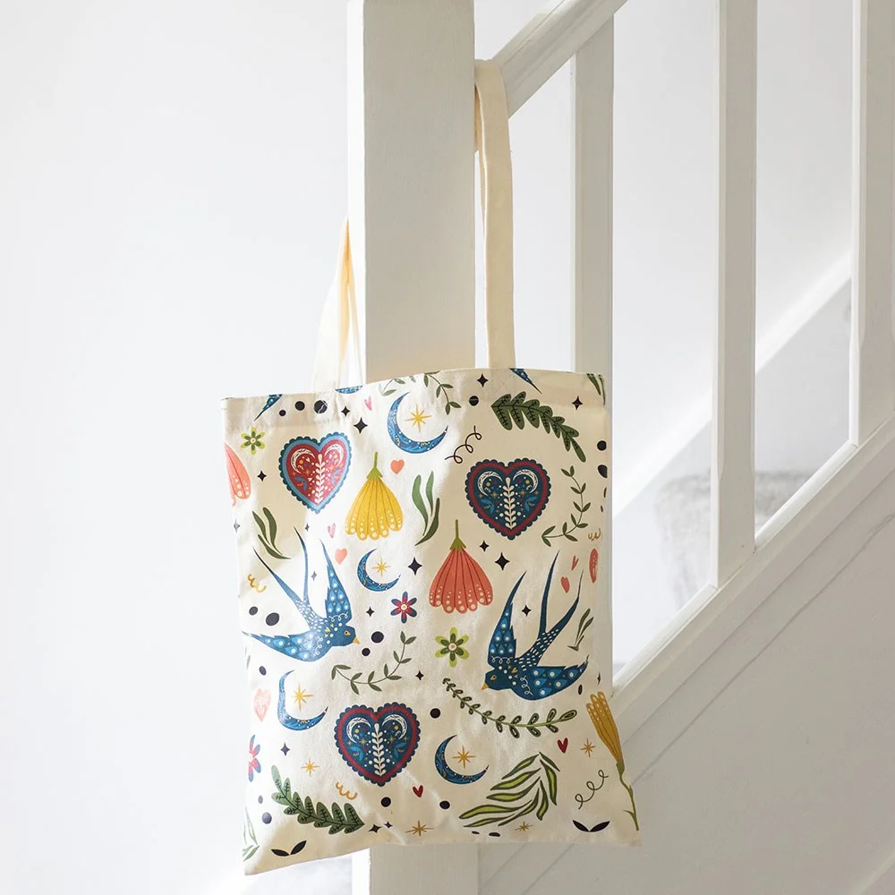 Cream polycotton tote bag with Midnight Bloom folk floral print, flat lay on white background
