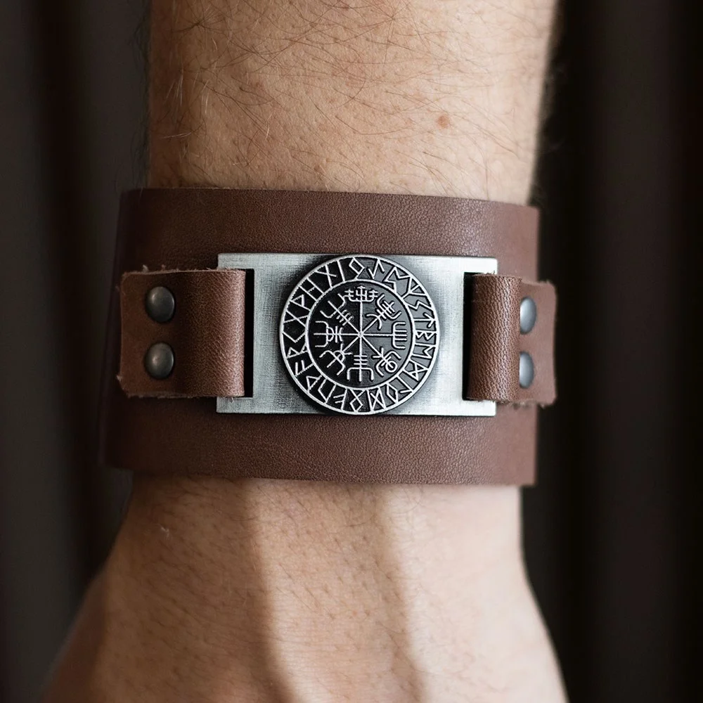 Brown leather Viking compass bracelet with Vegvisir symbol and snap closures on white background