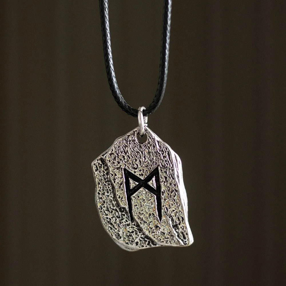 Rune of Transformation necklace with a black cord featuring an ancient Viking symbol pendant on a white background