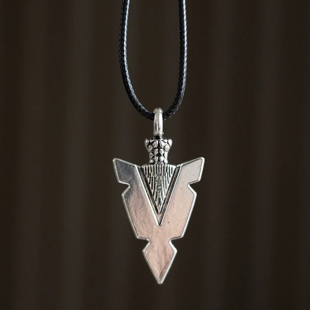 Viking arrowhead necklace with detailed metal pendant on black cord, symbolizing strength and warrior energy